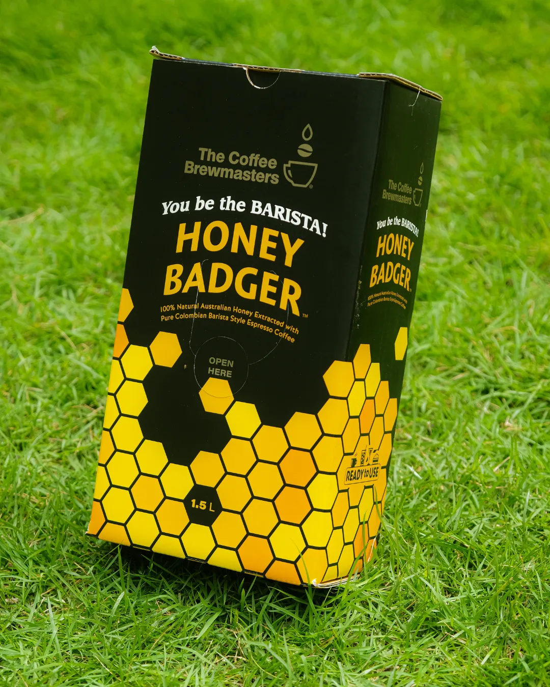 The Honey Badger 1.5L box on the grass